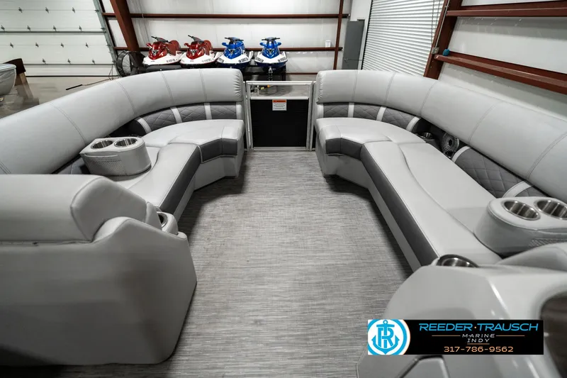 Slide: The Image of 2022 Bennington 22 LSB pontoon boat interior with gray seating and cup holders. - 17