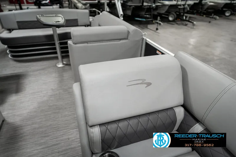 Slide: The Image of 2022 Bennington 22 LSB boat interior with gray seating and logo. - 19