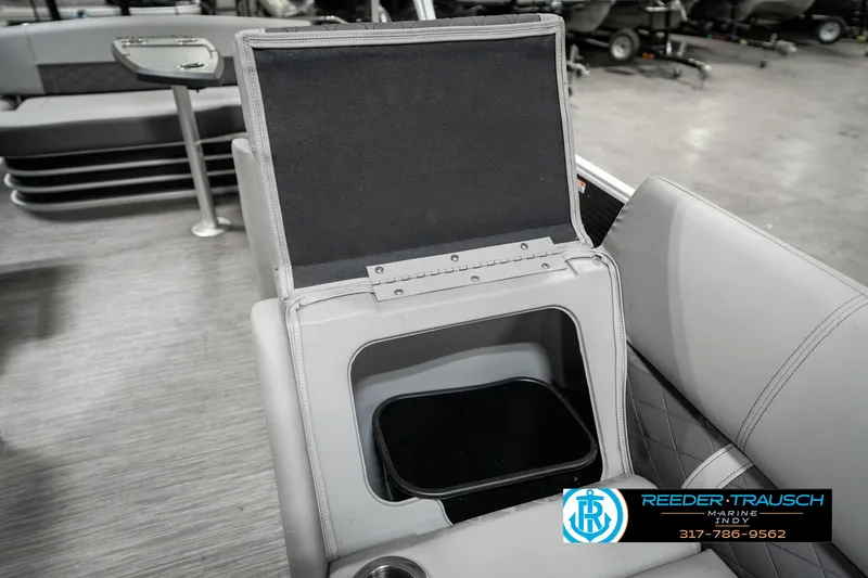 Slide: The Image of Open storage compartment on 2022 Bennington 22 LSB boat interior. - 20