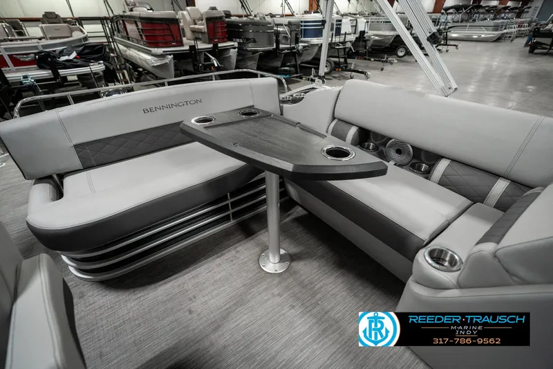 Slide: The Image of 2022 Bennington 22 LSB pontoon boat interior with seating and table. - 21
