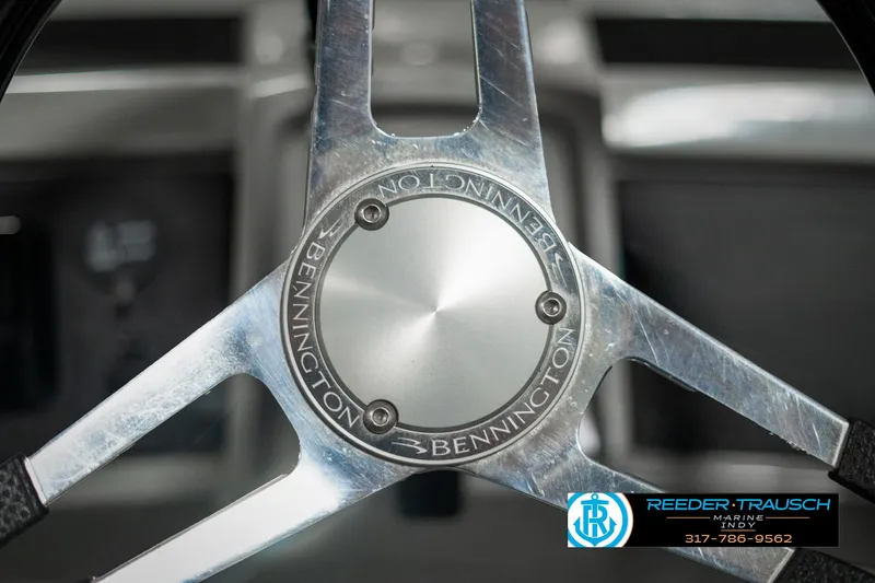 Slide: The Image of Steering wheel of 2022 Bennington 22 LSB boat, featuring Reeder-Trausch Marine logo. - 29
