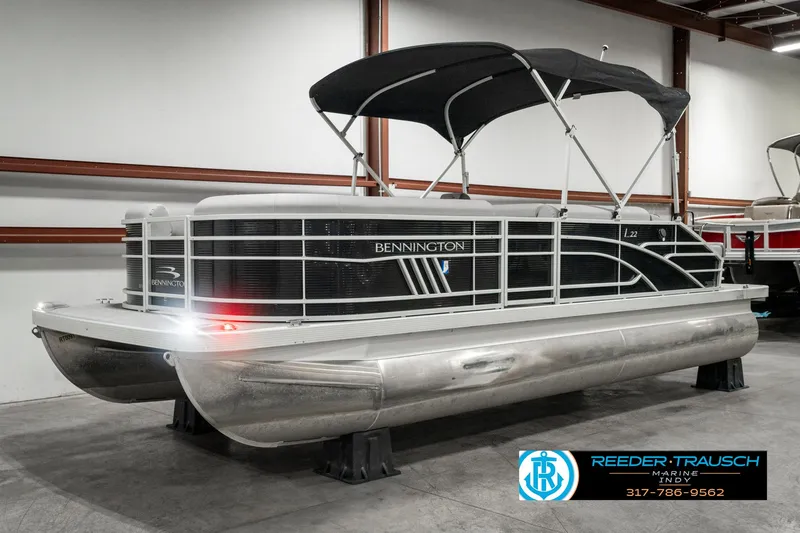 Slide: The Image of 2022 Bennington 22 LSB pontoon boat with black canopy in showroom. - 3
