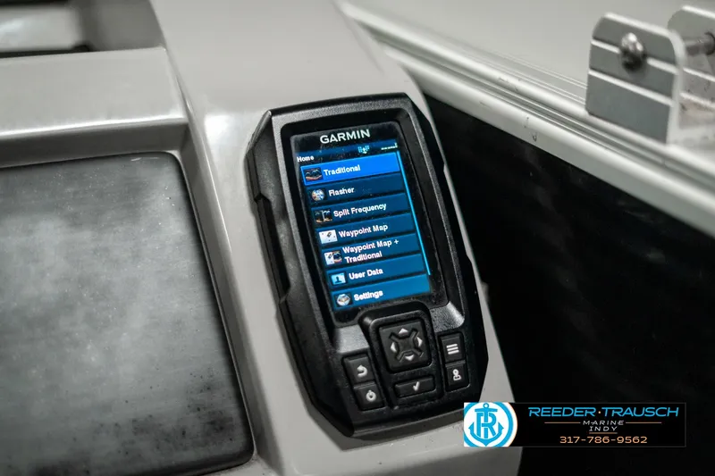 Slide: The Image of Garmin device on 2022 Bennington 22 LSB boat dashboard, displaying navigation options. - 35