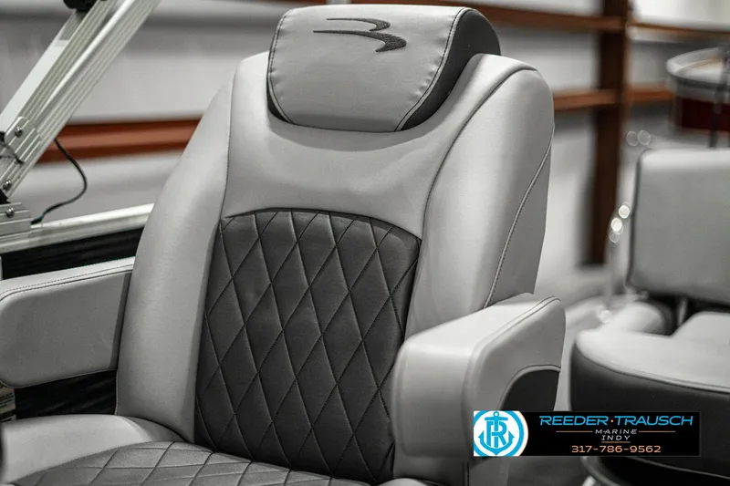 Slide: The Image of 2022 Bennington 22 LSB boat seat with diamond-stitched upholstery and armrests. - 36