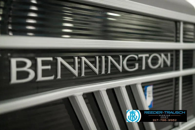 Slide: The Image of Close-up of 2022 Bennington 22 LSB logo on a sleek black surface. - 48