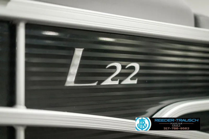 Slide: The Image of 2022 Bennington 22 LSB boat model emblem with dealership logo. - 49