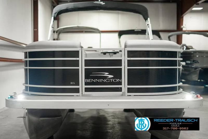 Slide: The Image of 2022 Bennington 22 LSB pontoon boat in showroom, front view. - 7