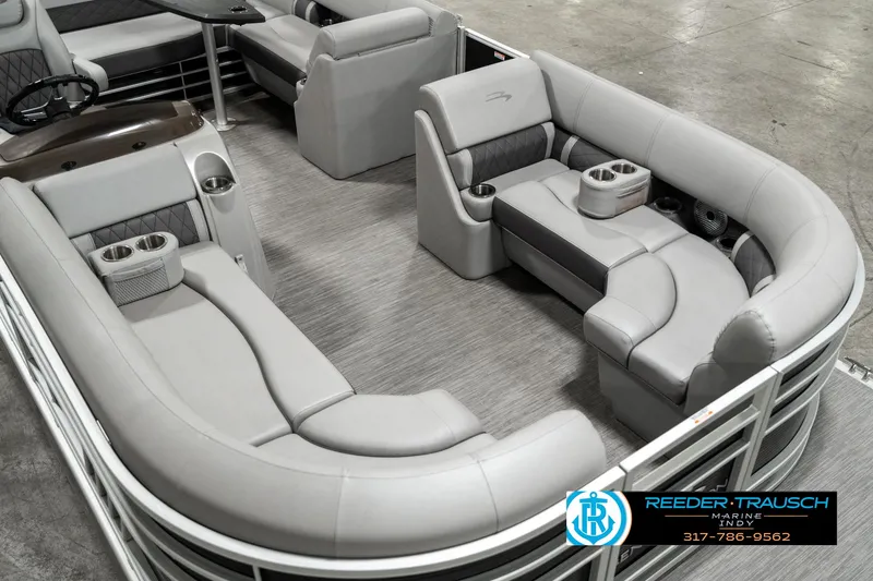 Slide: The Image of 2022 Bennington 22 LSB pontoon boat with luxurious gray seating and cup holders. - 9