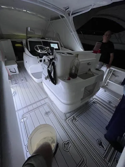 Slide: The Image of 2008 Intrepid Cuddy boat interior with modern dashboard and seating. - 1
