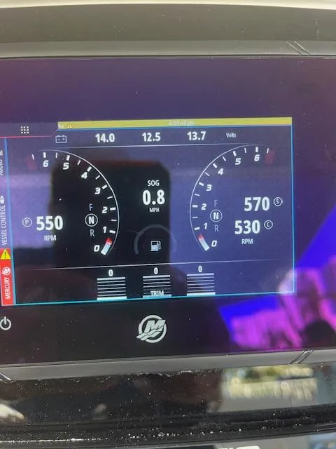 Slide: The Image of Dashboard of a 2008 Intrepid Cuddy boat showing RPM and speed. - 3