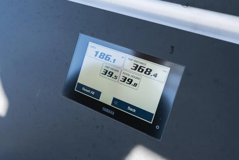 Slide: The Image of Yamaha display on 2023 Everglades 243cc Sport Station showing trip data. - 16