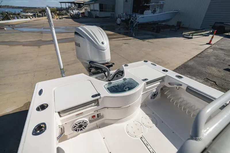 Slide: The Image of 2023 Everglades 243cc Sport Station boat with Yamaha outboard motor at dock. - 34