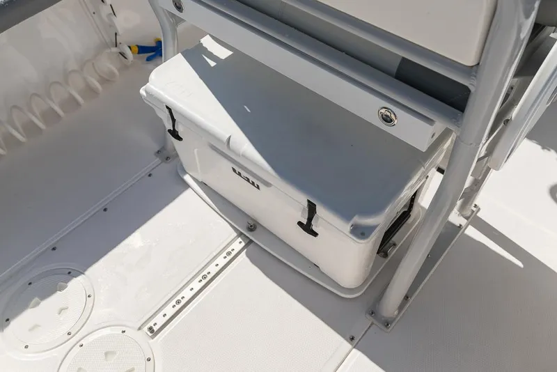 Slide: The Image of 2023 Everglades 243cc Sport Station boat interior with storage compartment. - 37