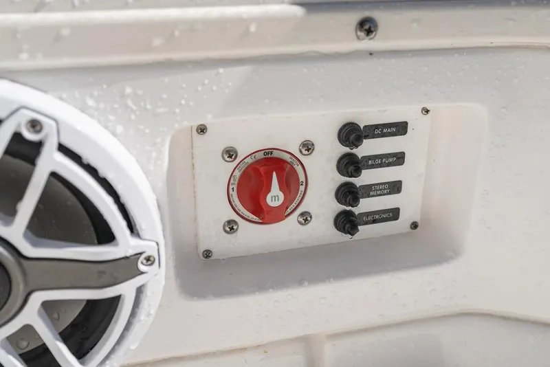 Slide: The Image of Close-up of 2023 Everglades 243cc Sport Station control panel with switches and speaker. - 40