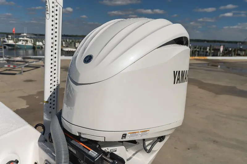 Slide: The Image of Yamaha outboard motor on 2023 Everglades 243cc Sport Station boat, dockside view. - 44