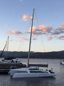 Slide: The Image of Corsair 760 trimaran sailboat docked at sunset, 2025 model. - 7