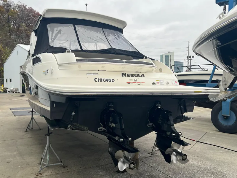 Slide: The Image of 2018 Sea Ray SLX 350 boat named "Nebula" in a marina setting. - 1