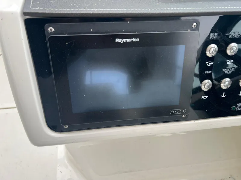 Slide: The Image of Raymarine display and control panel on 2018 Sea Ray SLX 350 boat. - 13