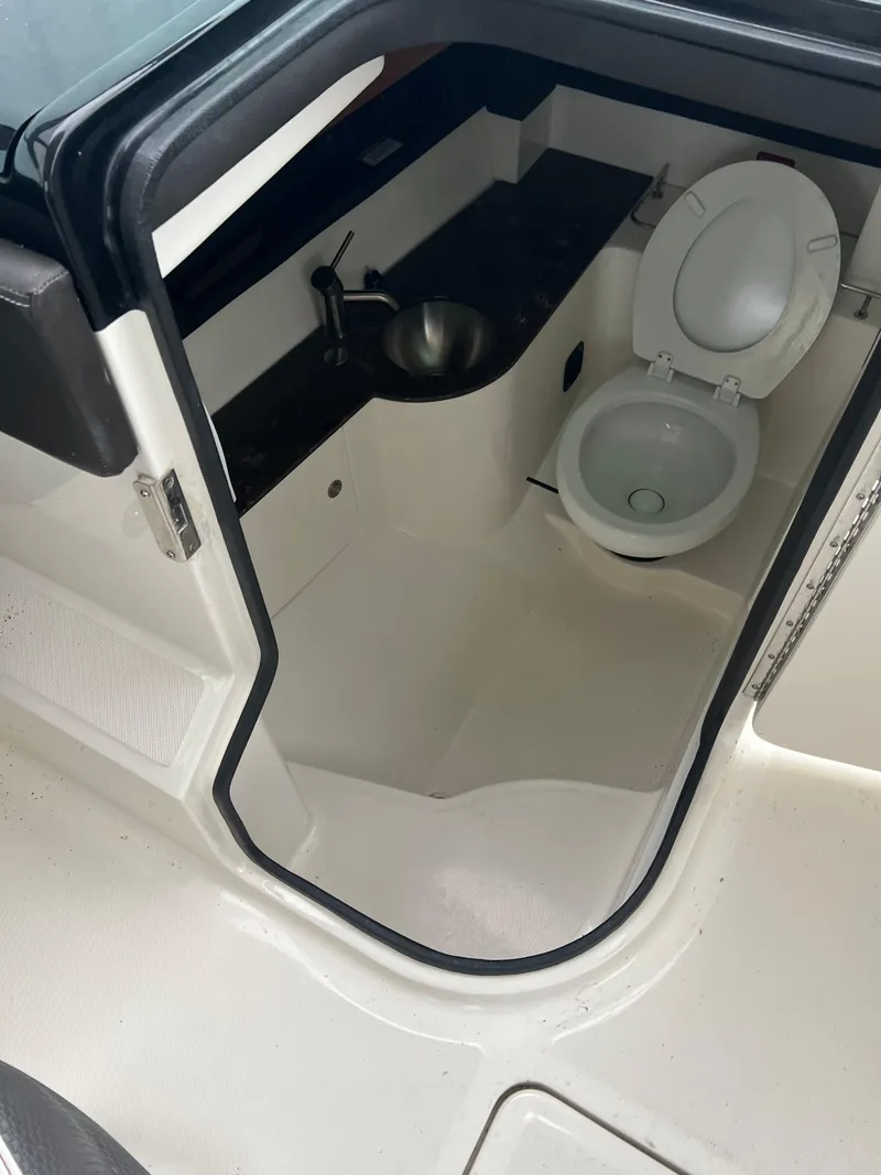 Slide: The Image of 2018 Sea Ray SLX 350 boat bathroom with sink and toilet. - 16