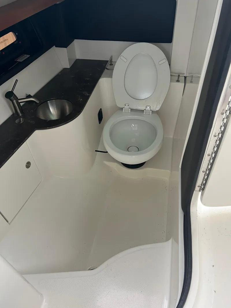 Slide: The Image of 2018 Sea Ray SLX 350 boat bathroom with sink and toilet. - 17