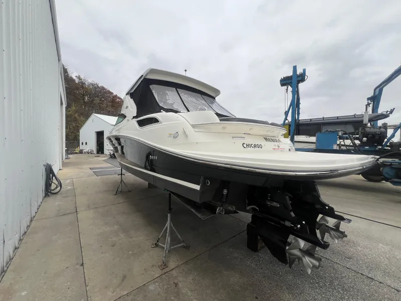 Slide: The Image of 2018 Sea Ray SLX 350 boat on dry dock, ready for maintenance. - 2