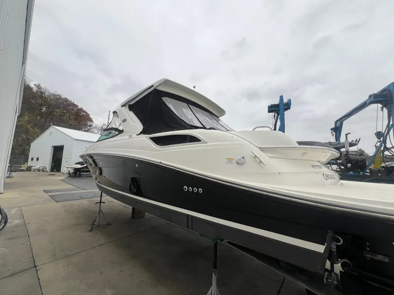 Slide: The Image of 2018 Sea Ray SLX 350 boat on dry dock, overcast sky background. - 3