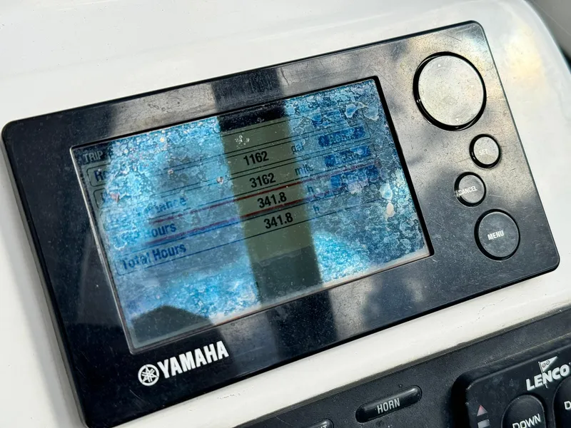 Slide: The Image of Yamaha display on 2013 Edgewater 245 CX boat showing trip and engine hours. - 25