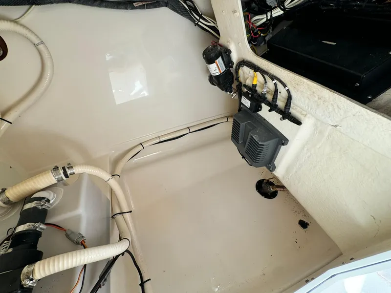 Slide: The Image of 2013 Edgewater 245 CX boat interior wiring and components. - 38