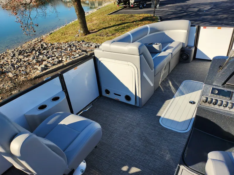 Slide: The Image of 2024 Crest Classic Platinum 220 boat interior with plush seating and modern design. - 20