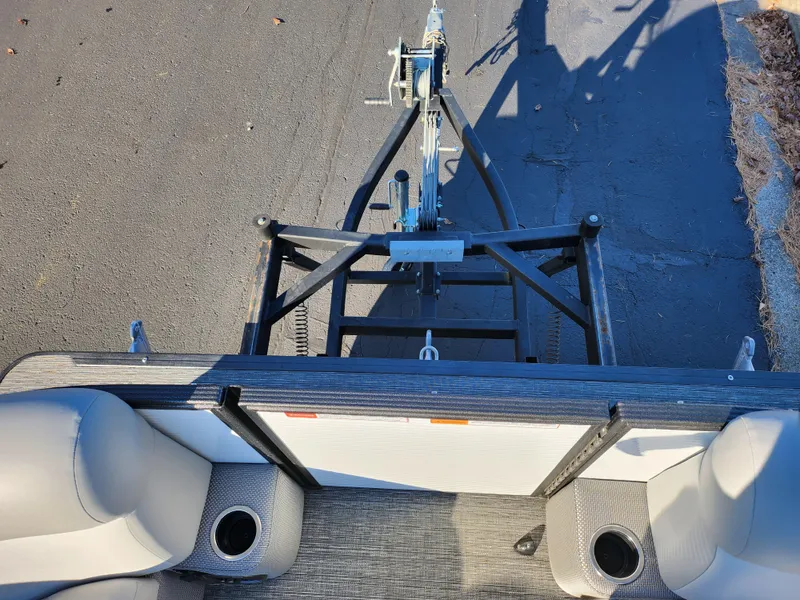 Slide: The Image of 2024 Crest Classic Platinum 220 boat interior with trailer hitch view. - 26