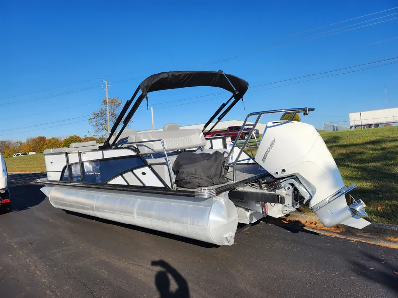 Slide: The Image of 2024 Crest Classic Platinum 220 pontoon boat with Mercury outboard on a sunny day. - 3