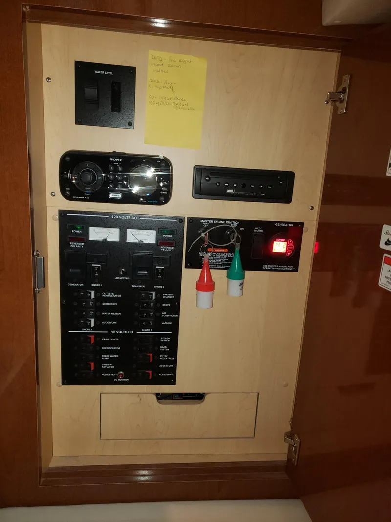 Slide: The Image of Electrical control panel on a 2011 Sea Ray 350 Sundancer boat. - 23