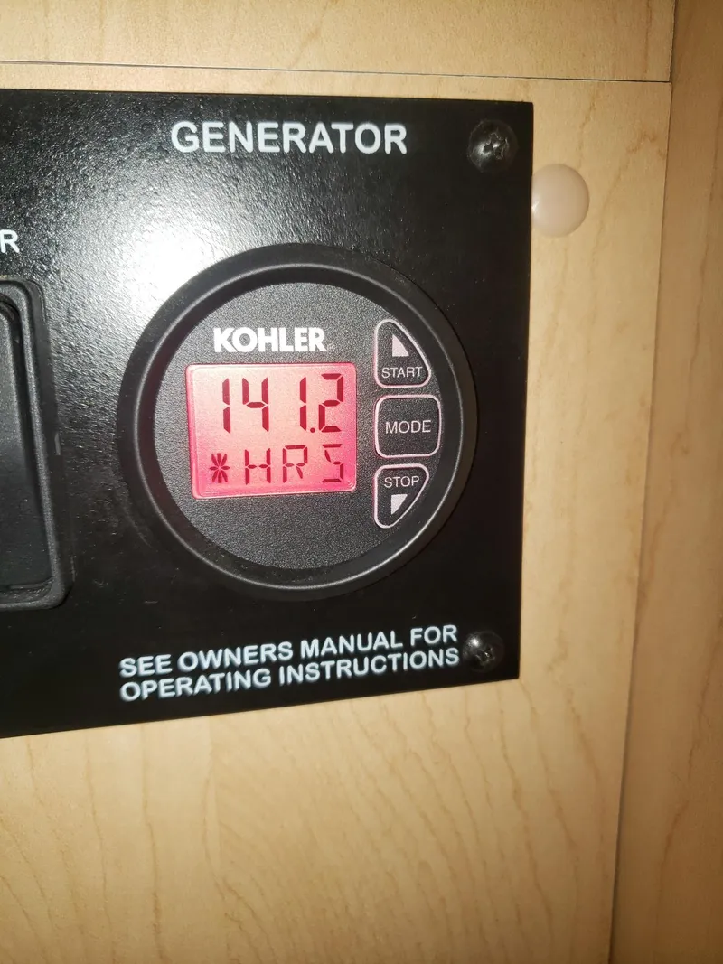 Slide: The Image of Kohler generator display showing 141.2 hours on a 2011 Sea Ray 350 Sundancer. - 24