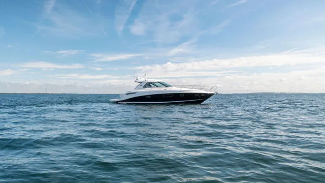 Slide: The Image of 2011 Sea Ray 350 Sundancer bathroom with sink, shower, and porthole window. - 32