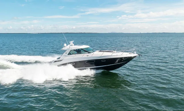 Slide: The Image of Engine compartment of a 2011 Sea Ray 350 Sundancer boat, showcasing detailed components. - 39