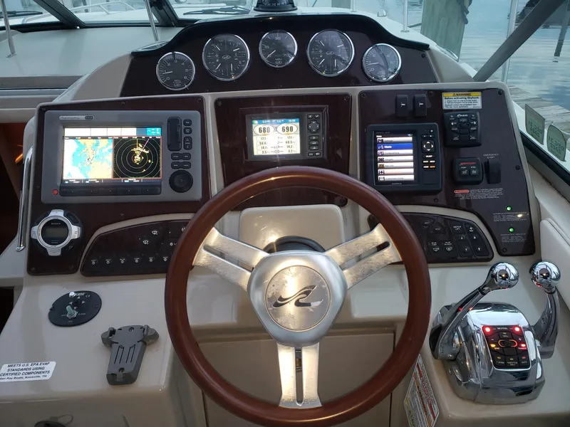 Slide: The Image of Helm of 2011 Sea Ray 350 Sundancer with navigation and control systems. - 5