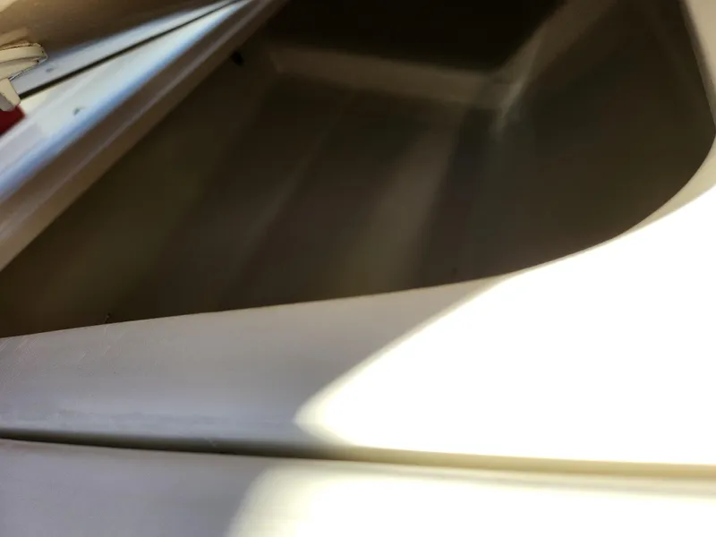 Slide: The Image of Interior view of a 2003 Larson SEi 180 boat compartment. - 14