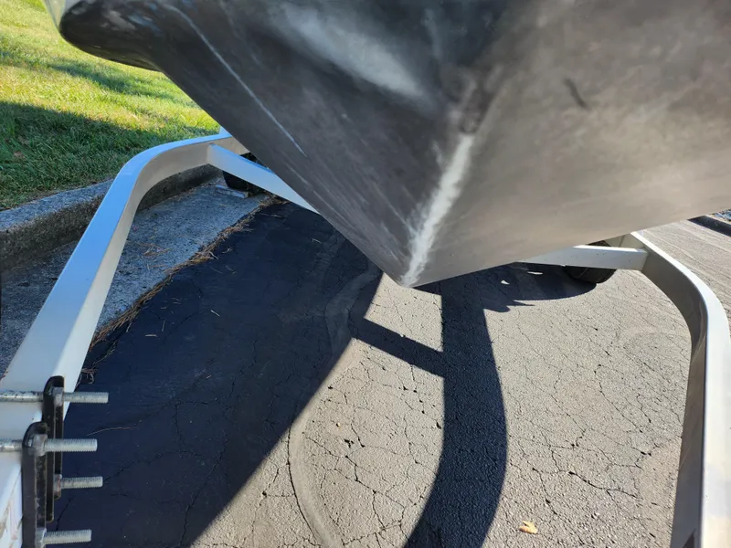Slide: The Image of Close-up of a 2003 Larson SEi 180 boat hull on a trailer. - 7