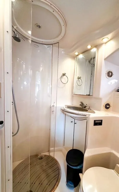 Slide: The Image of Luxurious bathroom in 1999 Maxum 4100 SCR yacht with shower and vanity. - 18