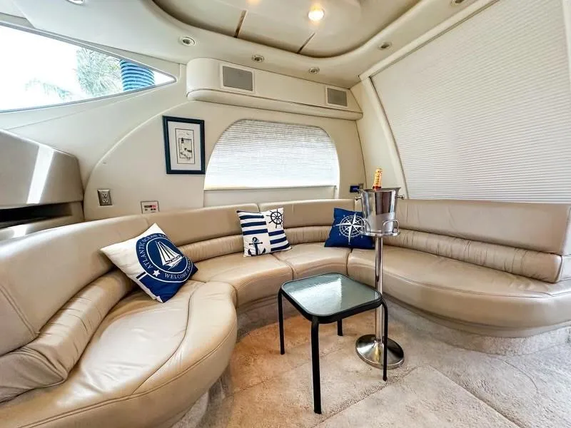 Slide: The Image of Luxurious interior of 1999 Maxum 4100 SCR yacht with plush seating and nautical decor. - 9