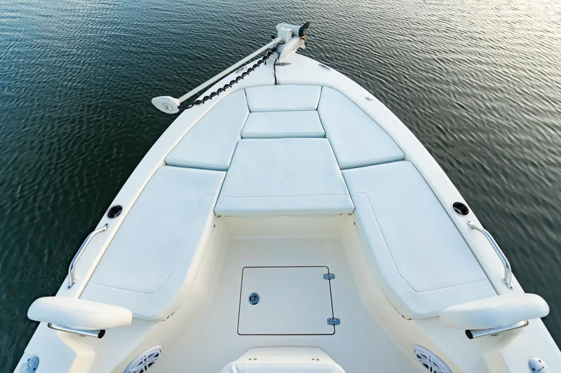Slide: The Image of 2025 Pathfinder 2200 TRS boat interior with open storage drawer and seating area. - 10