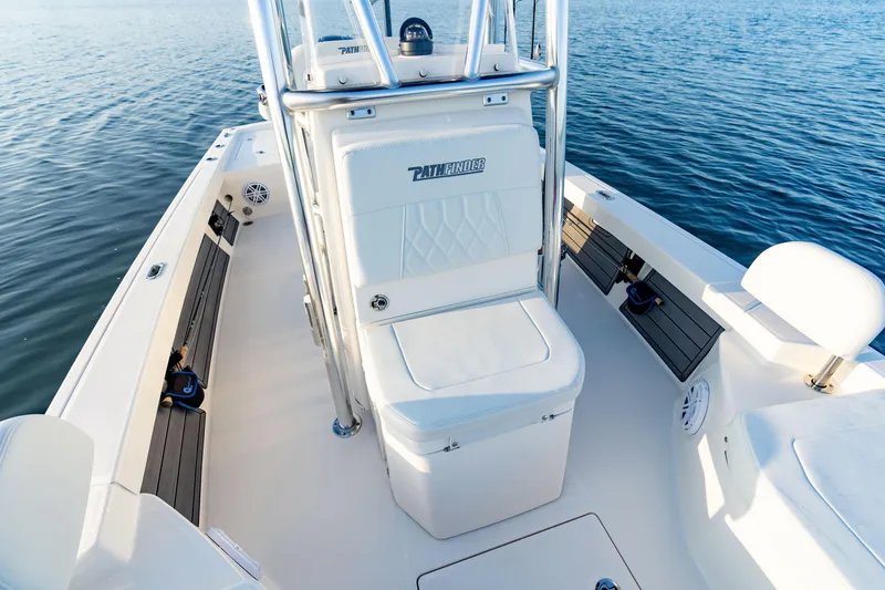 Slide: The Image of 2025 Pathfinder 2200 TRS boat interior with white deck and speaker detail. - 12