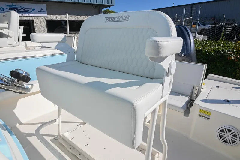 Slide: The Image of 2025 Pathfinder 2200 TRS boat seat with white upholstery and armrests. - 20