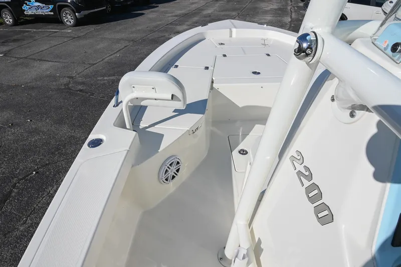 Slide: The Image of 2025 Pathfinder 2200 TRS boat interior, showcasing seating and deck features. - 23