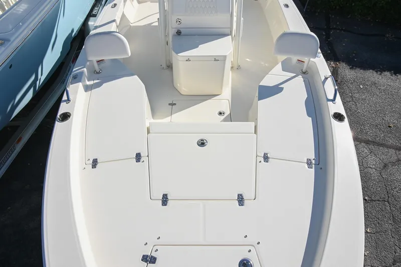 Slide: The Image of 2025 Pathfinder 2200 TRS boat deck with seating and storage compartments. - 25