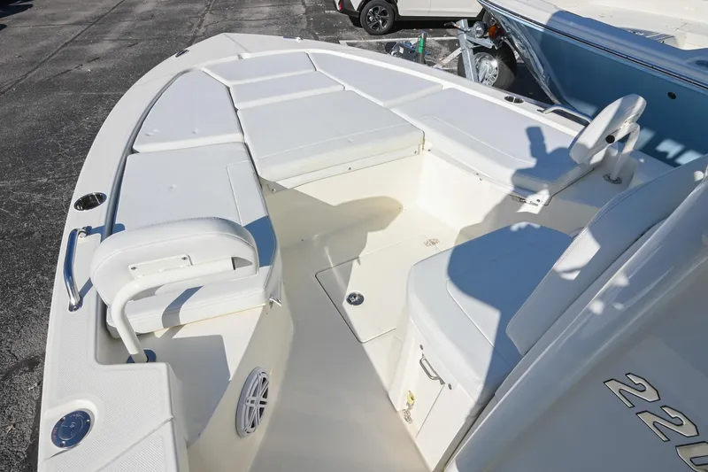 Slide: The Image of 2025 Pathfinder 2200 TRS boat interior with white seating and deck details. - 29