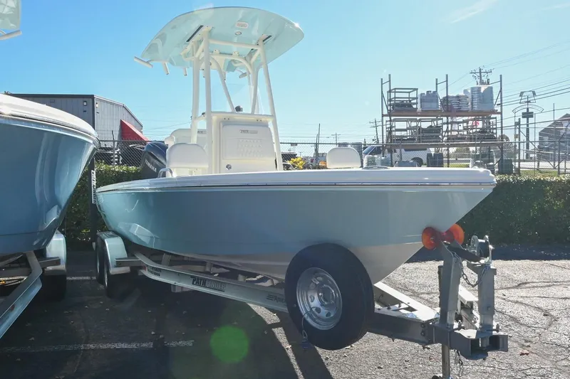 Slide: The Image of 2025 Pathfinder 2200 TRS boat on trailer in outdoor lot. - 3