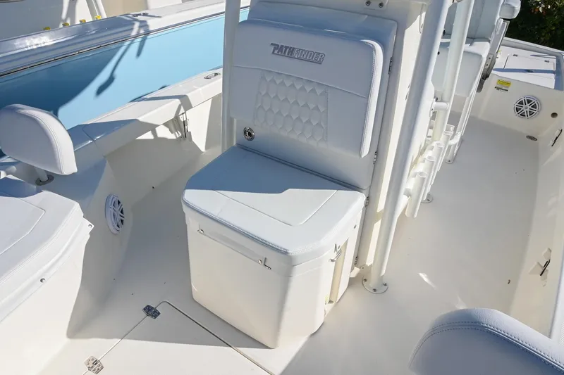 Slide: The Image of 2025 Pathfinder 2200 TRS boat interior with cushioned seating and storage. - 32