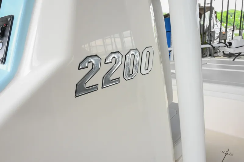 Slide: The Image of Pathfinder 2200 TRS 2025 model boat with chrome emblem detail. - 39