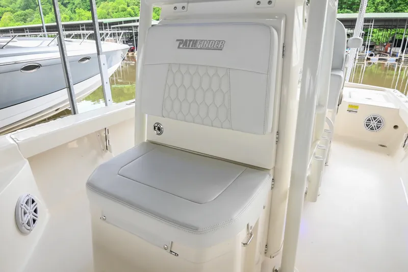 Slide: The Image of 2025 Pathfinder 2200 TRS boat interior with cushioned seating and sleek design. - 44